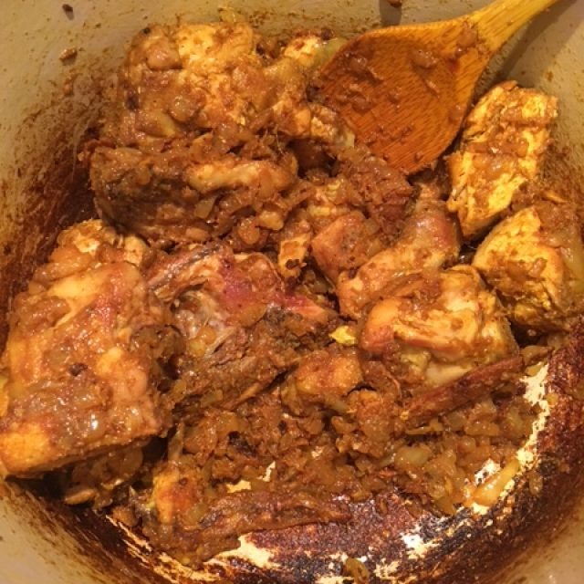 Coating the chicken with the spices